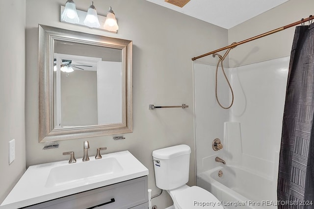 full bathroom with shower / tub combo with curtain, ceiling fan, vanity, and toilet