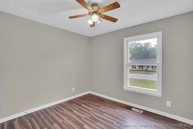 unfurnished room with ceiling fan and hardwood / wood-style flooring