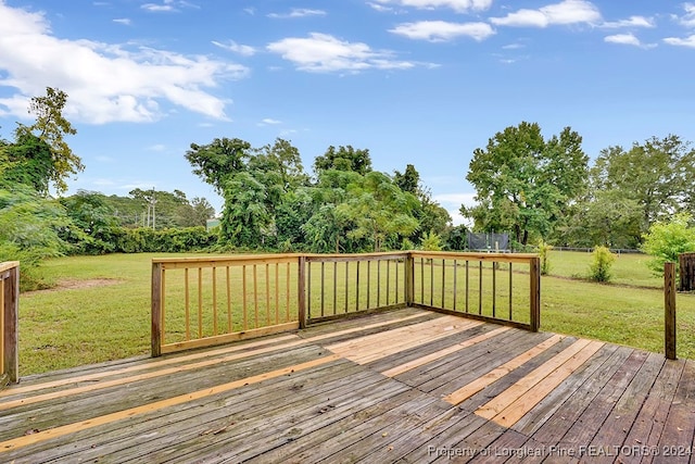 wooden deck with a lawn