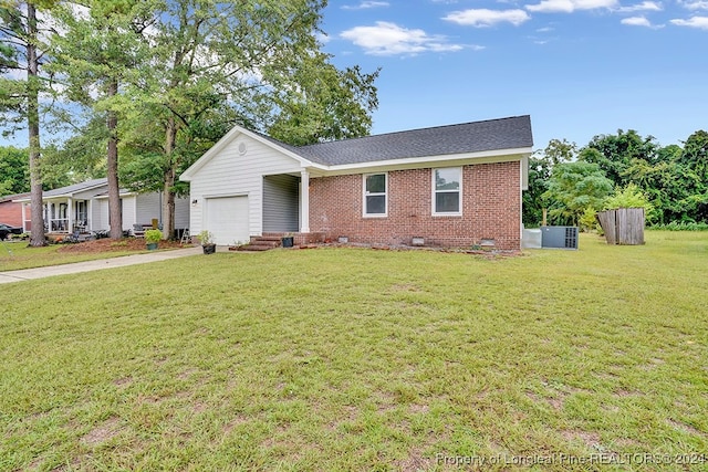 single story home featuring a front yard and a garage