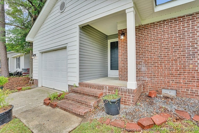 property entrance with a garage