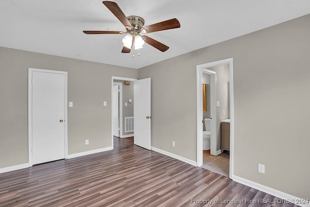 unfurnished bedroom with a textured ceiling, light hardwood / wood-style floors, ceiling fan, and ensuite bathroom