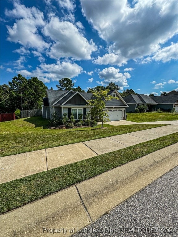 view of front facade with a garage and a front yard