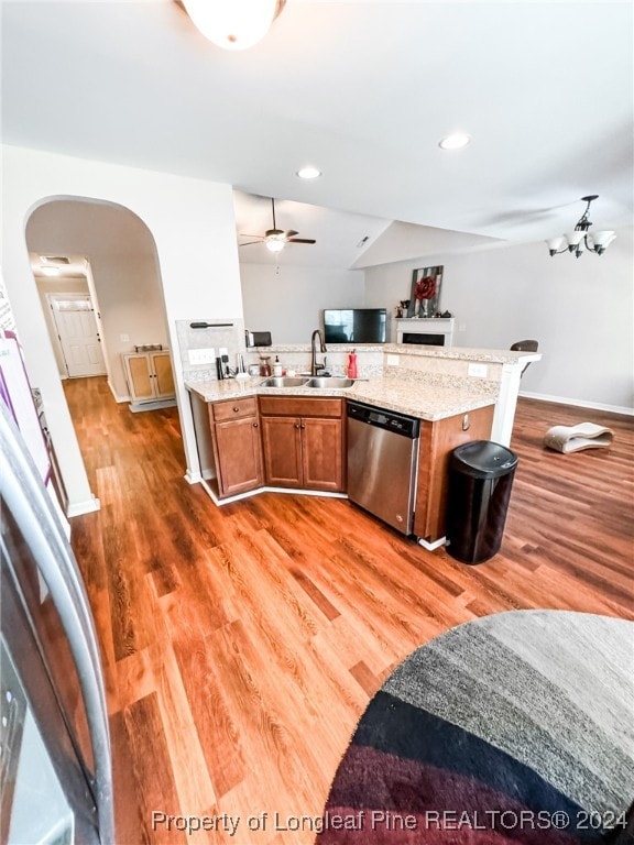 kitchen with wood-type flooring, dishwasher, ceiling fan, and sink