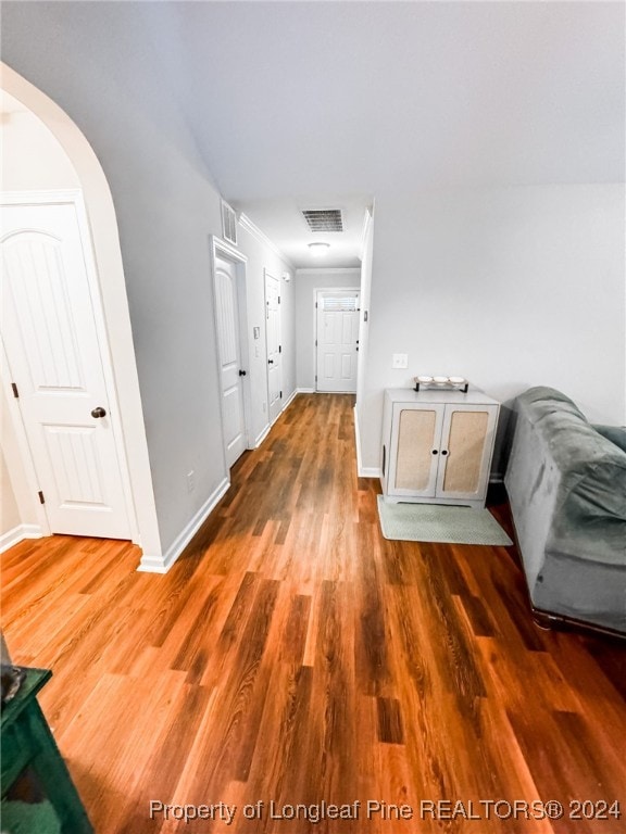 corridor with dark hardwood / wood-style floors