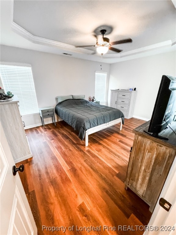 bedroom with ceiling fan and hardwood / wood-style floors