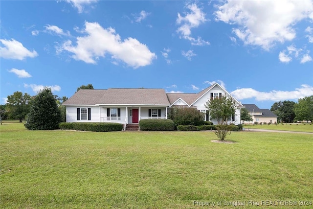 ranch-style house with a front lawn and covered porch