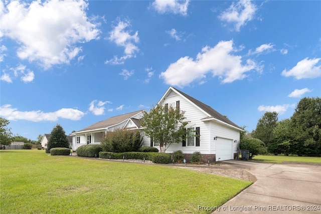 view of front of house featuring a front yard and a garage