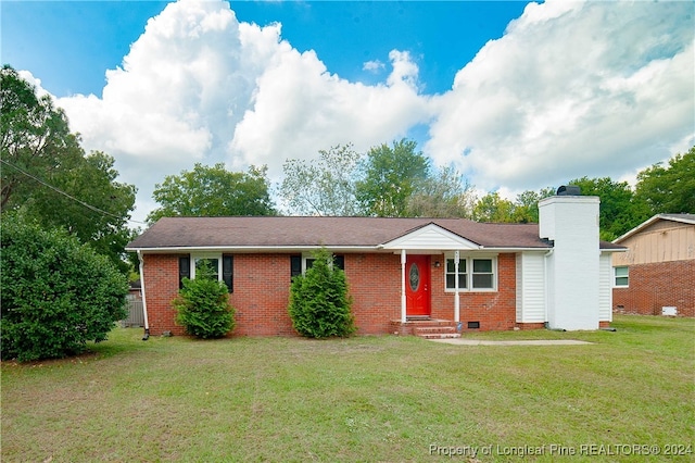 single story home with a front yard