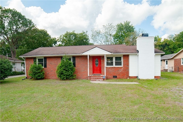 single story home with a front lawn