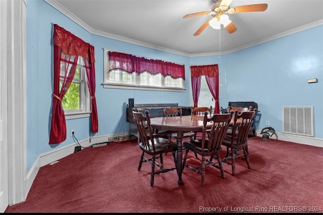 dining area featuring ceiling fan, ornamental molding, and carpet