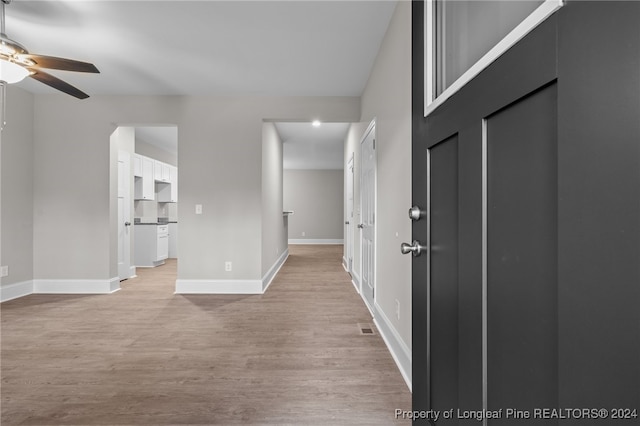 interior space featuring ceiling fan and light wood-type flooring