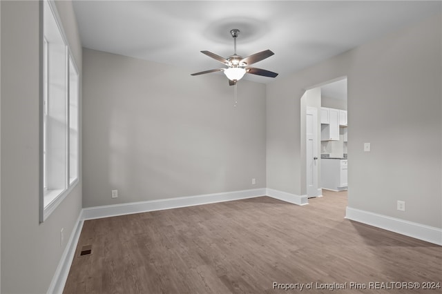 spare room featuring ceiling fan and wood-type flooring