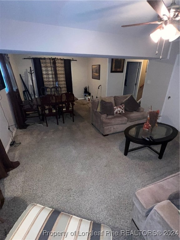 living room featuring carpet flooring and ceiling fan