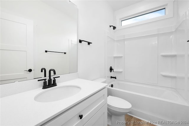 full bathroom featuring vanity, toilet, and  shower combination