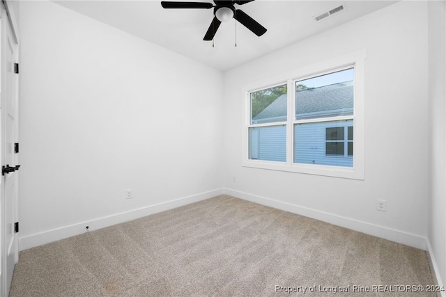 carpeted empty room with ceiling fan