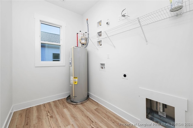 laundry room featuring hookup for a washing machine, hardwood / wood-style flooring, hookup for an electric dryer, and water heater