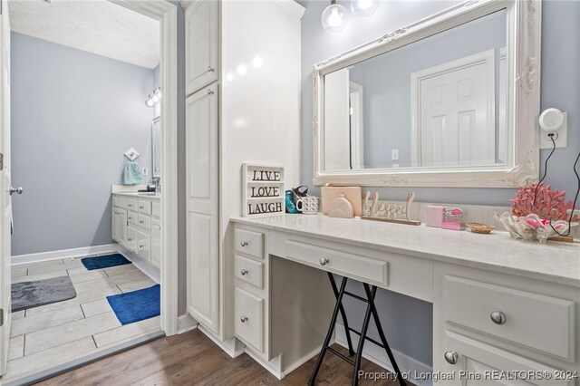 bathroom featuring vanity and wood-type flooring