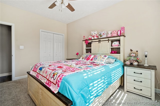 carpeted bedroom featuring ceiling fan and a closet