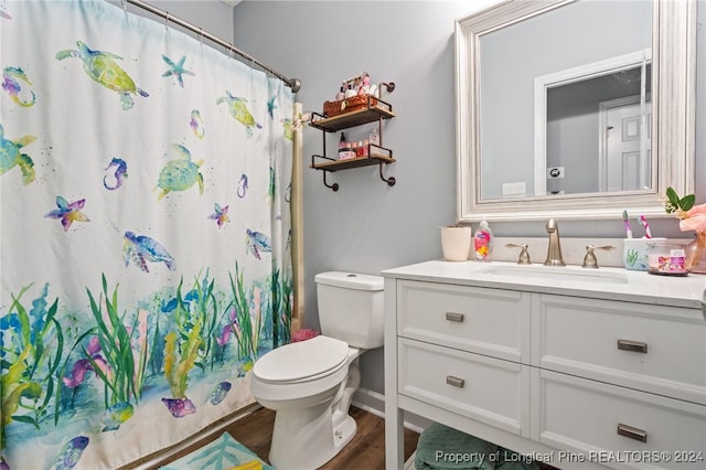 bathroom featuring hardwood / wood-style floors, vanity, and toilet