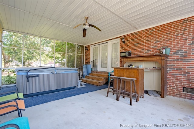 view of patio / terrace with a hot tub and ceiling fan