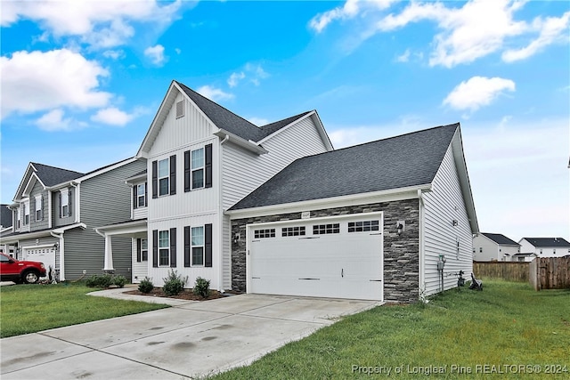 view of front facade featuring a front yard and a garage