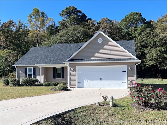 ranch-style home with a front yard and a garage