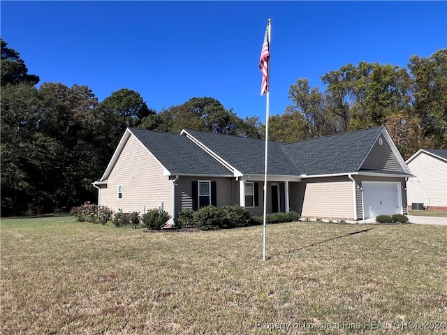 single story home featuring a garage, a front lawn, and central air condition unit