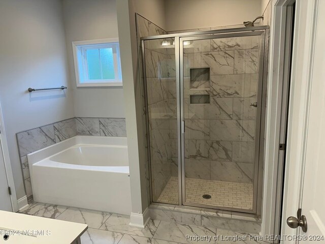 bathroom featuring plus walk in shower