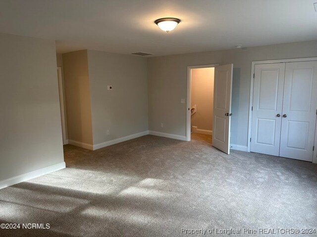 spare room featuring carpet floors