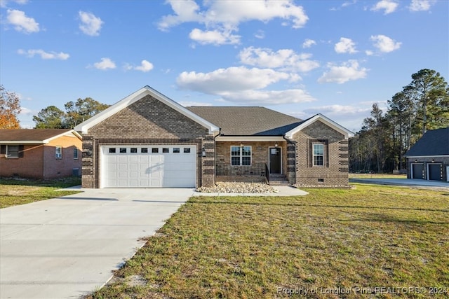 view of front facade featuring a front yard and a garage