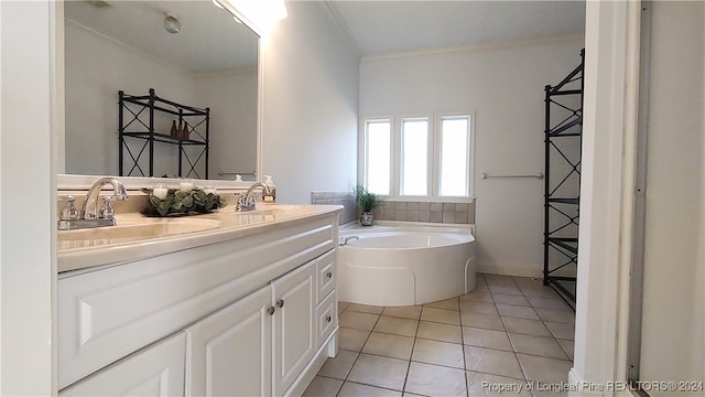 bathroom with a bath, tile patterned flooring, and vanity