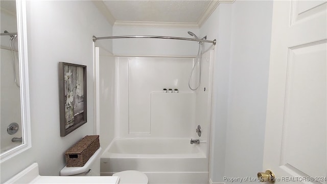 bathroom with a textured ceiling, toilet, crown molding, and shower / washtub combination