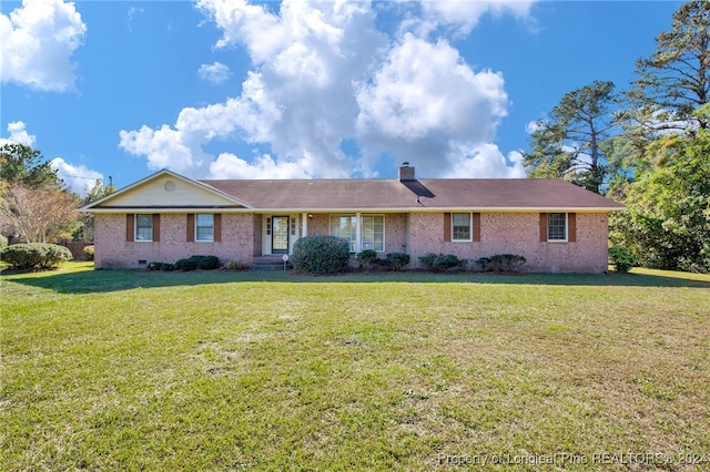 single story home with a front lawn