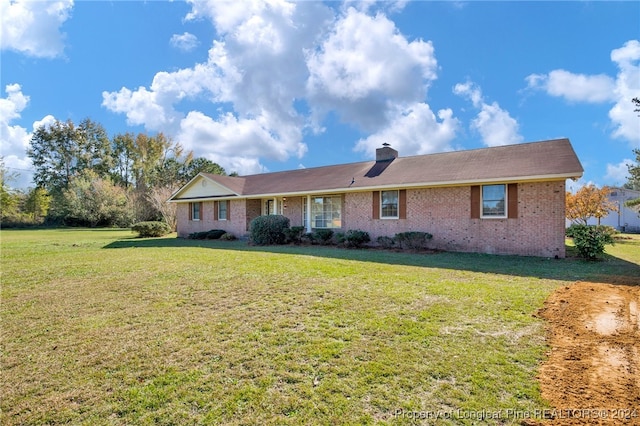 single story home featuring a front yard