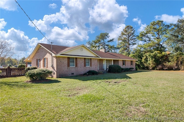 single story home with a front yard