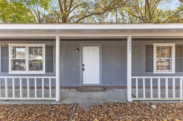 doorway to property with a porch