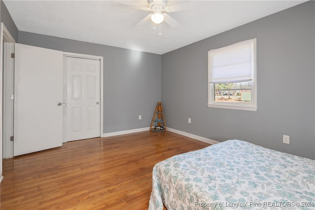 bedroom featuring ceiling fan and wood-type flooring