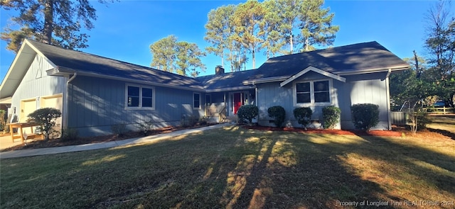 view of front of home featuring a garage and a front yard