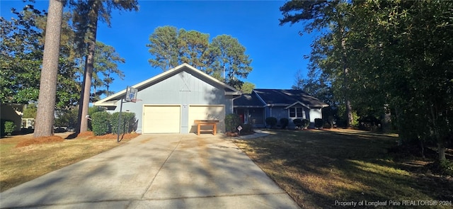 view of front of home with a garage and a front lawn