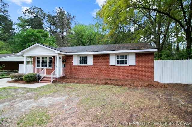 ranch-style house with a carport