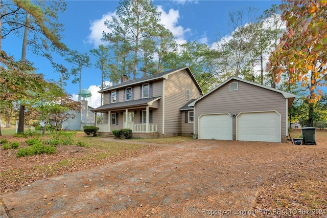 front of property featuring a porch and a garage