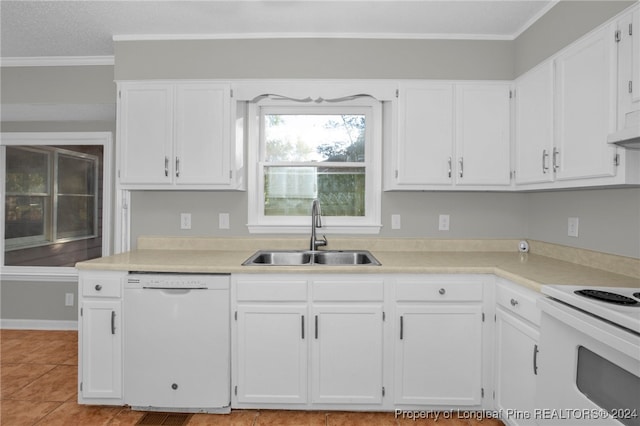 kitchen with white cabinetry, crown molding, white appliances, and sink