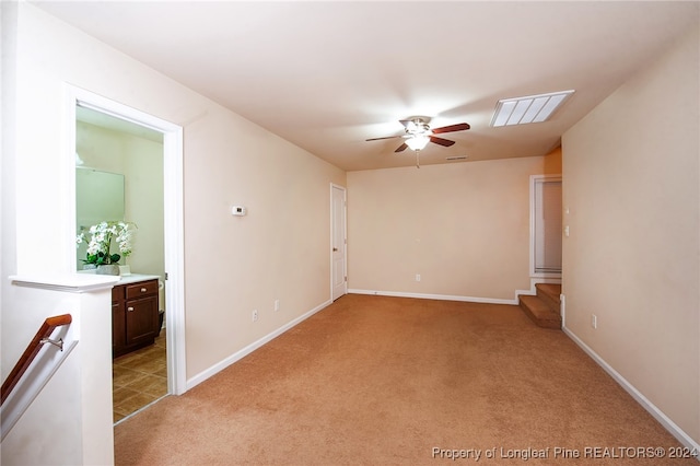 carpeted empty room with ceiling fan