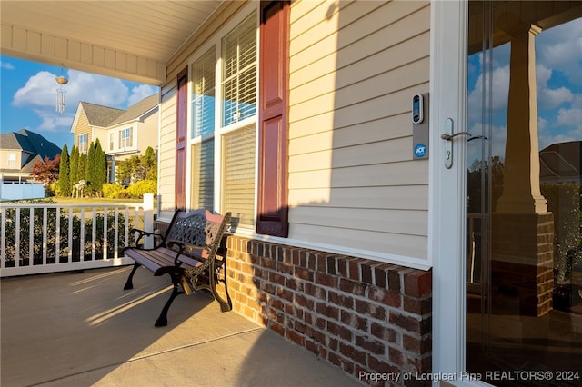 view of patio featuring covered porch and french doors