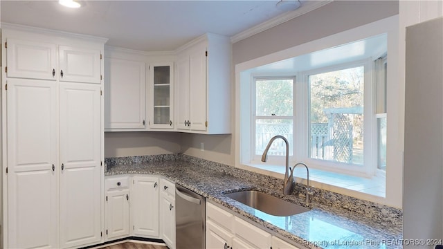 kitchen featuring sink, light stone counters, stainless steel dishwasher, white cabinets, and ornamental molding