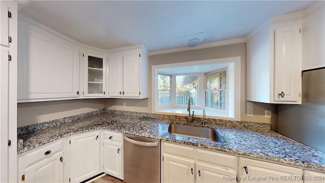 kitchen with white cabinetry, sink, and stainless steel dishwasher