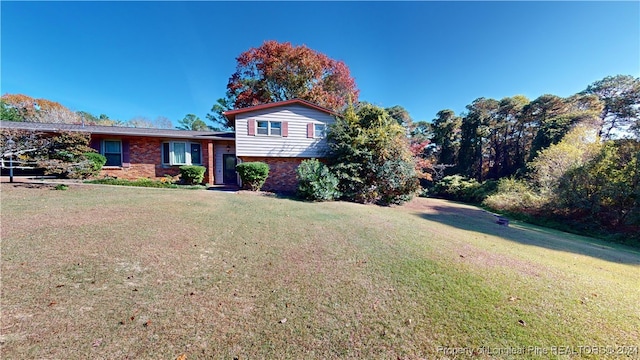 split level home featuring a front yard