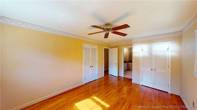 unfurnished bedroom featuring ceiling fan and wood-type flooring