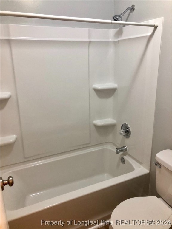 bathroom with shower / bath combination and toilet